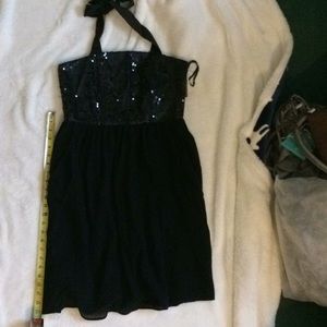 Black sequin halter dress.